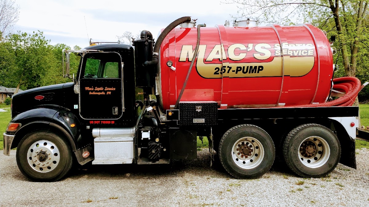 Mac's Septic Service tanker truck with black cab and red tank, branded with the company name and 257-PUMP phone number